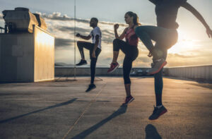 Three People Exercising Outdoors